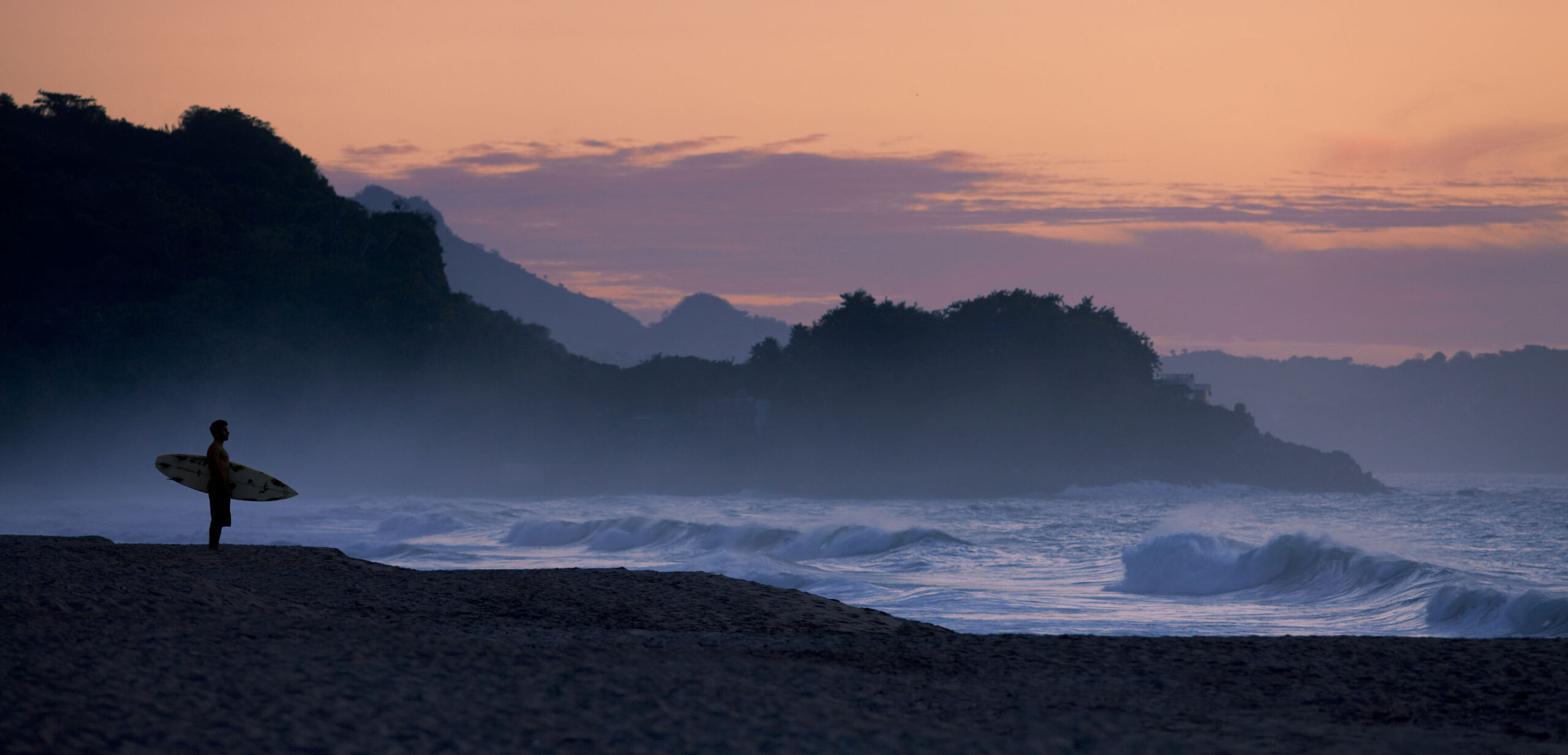 Tyler Strateman on the beach at San Pancho (composite)sunset